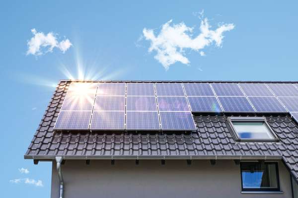 Solar panels mounted on a residential roof during installation